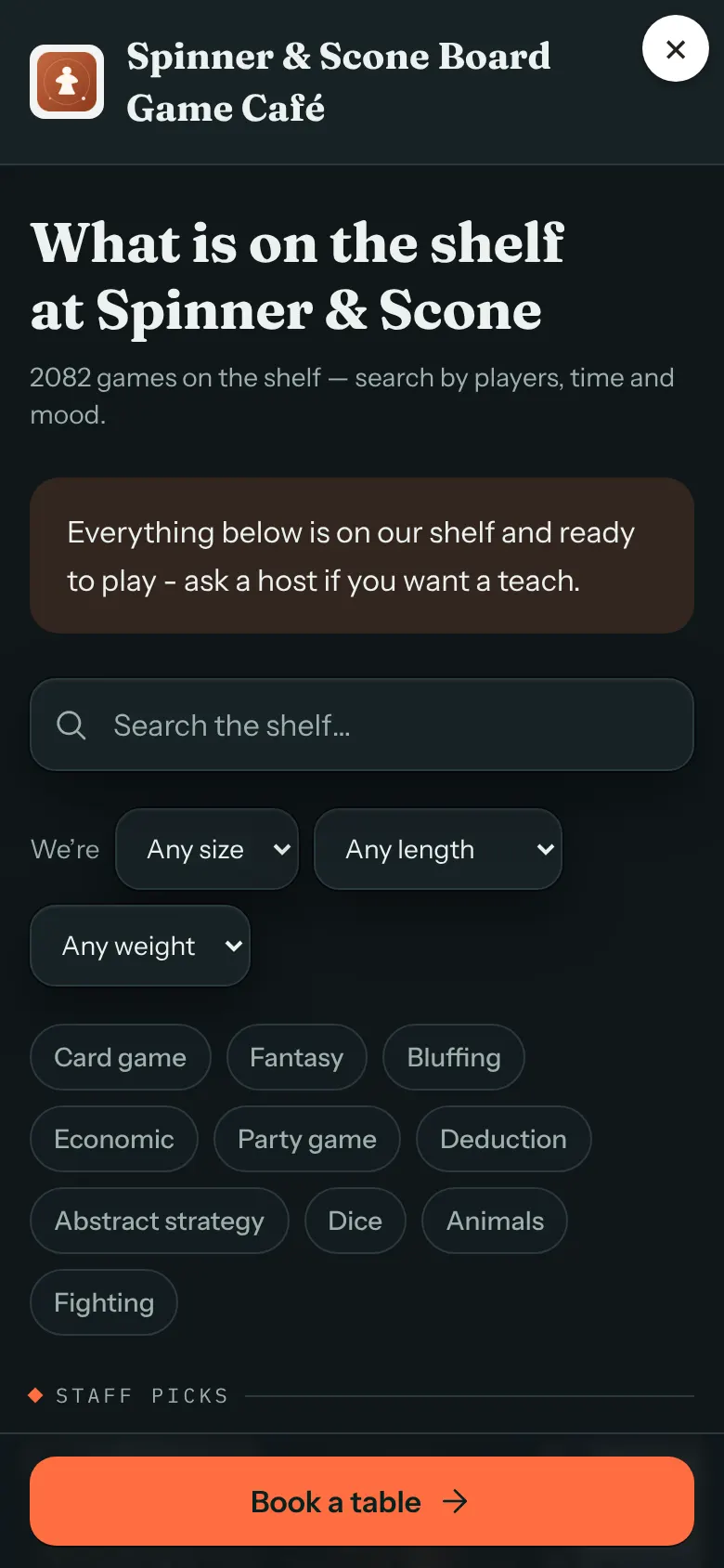 A phone showing the game list filling the screen, with a close button in the top corner, a search box and filters, and a Book a table button at the bottom.