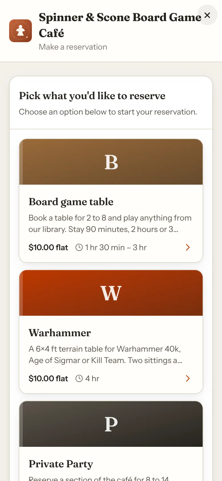 A phone showing the booking window filling the screen, with a close button and the Spinner & Scone Board Game Café header above the reservation types.