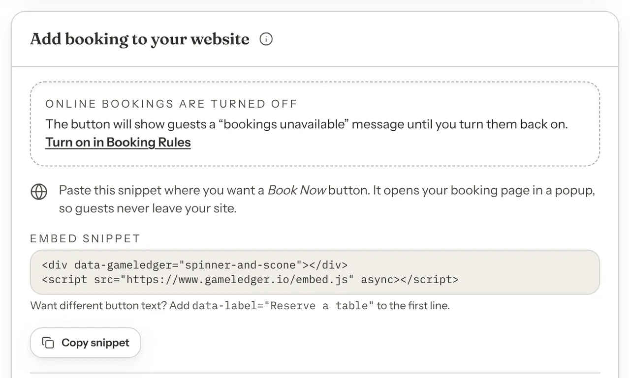 The Add booking to your website card with a boxed message at the top reading Online bookings are turned off, with a Turn on in Booking Rules link, above the embed snippet.